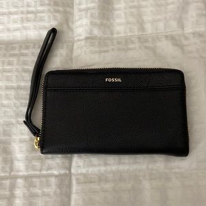 Fossil black leather wristlet with gold accents.